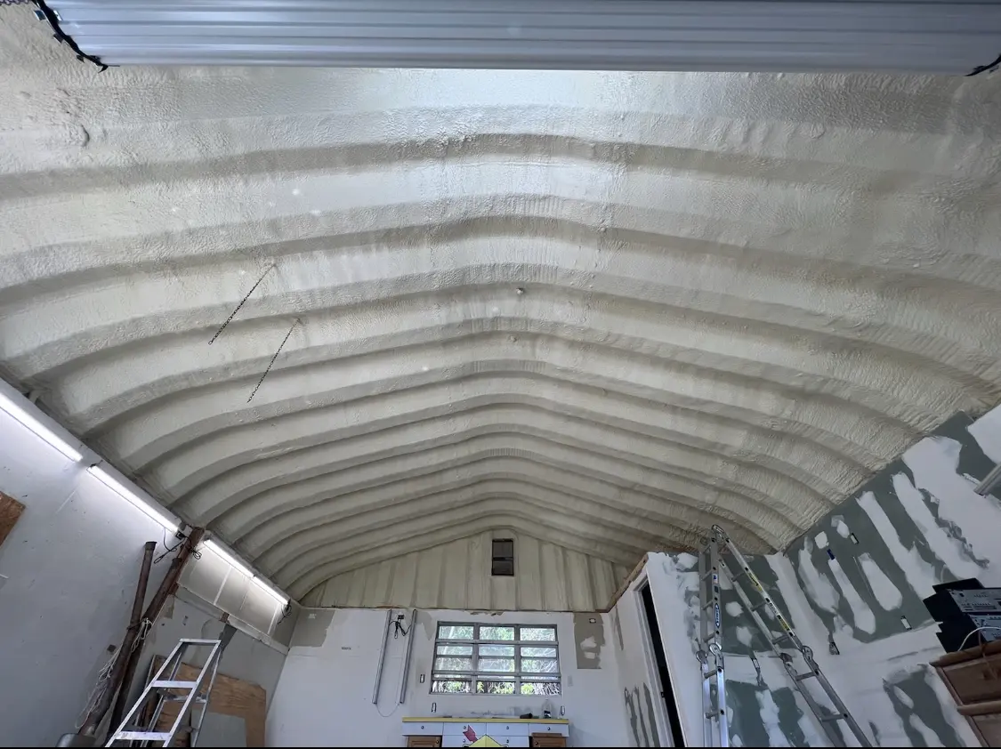 Spray polyurethane foam applied to the underside of a metal roof deck in San Dimas